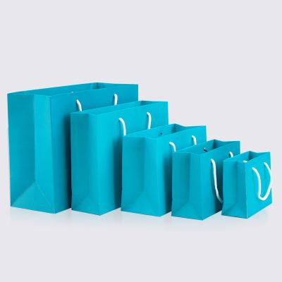 China Handmade blue paper bag gift apparel gift packaging shopping bag belt support printing 1 color simple logo for sale