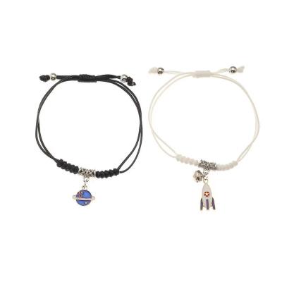 China Wholesale Hiphop China Alloy Planet Rocket Bells Material Couple Woven Adjustable One Pair Bracelet for sale