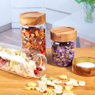 China Art Decor High Grade Kitchen Borosilicate Glass Storage Containers 200ml 260ml 300ml 400ml 500ml Jar With Wooden Screw Lids for sale