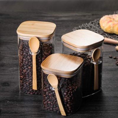 China Freshness Storage Square Glass Canister Airtight Sugar Jar With Lid Spoon Spice Jar for sale