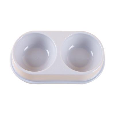 China Viable Wholesale Oval Pet Double Bowl Cat Diet Bowl Thickened Plastic 2 in 1 Double Pet Bowl for sale