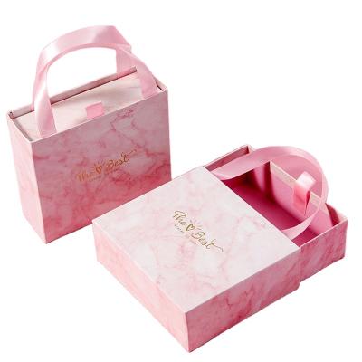 China Recyclable Ready To Ship Recyclable Pink Paper Cardboard Drawer Gift Box Packaging With Handle for sale