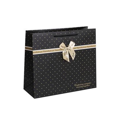 China Recyclable Custom Paper Gift Bags Boutique Jewelry Luxury Paper Bag With Ribbon Tie Bow for sale