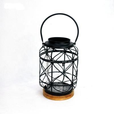 China ECO-frendly IVYDECO Antique Metal Iron Birdcage Lanterns Home Decorative Black Candle Holder with Glass and Wood Bottom for sale