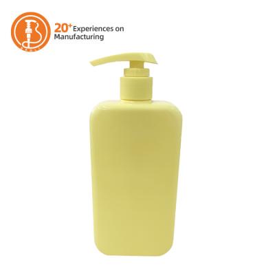 China Bomba de loção PET amarelo personalizada de 500 ml para gel de chuveiro e shampoo de limpeza à venda