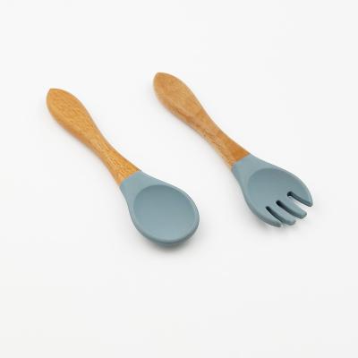 China BPA Free Baby Blue Handle Silicone Spoon Wooden Fork Set for sale