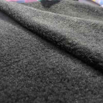 China Cheap anti pill common touch fleece plain dyed one side brushed fabric and anti pilling side black in knitted as lining for clothing for sale