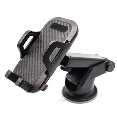 China Clamp Adjustable Auto Carbon Dash Car Mobile Phone Welding Holder Suitable for iPhone, Samsung, Huawei, Xiaomi Car Phone Mount for sale