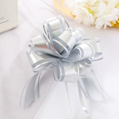 China New pp. Factory direct sales competitive festival decoration fitting Matte Film Ball Flower Snow yarn pom poms draw bow ribbon pull bows for sale