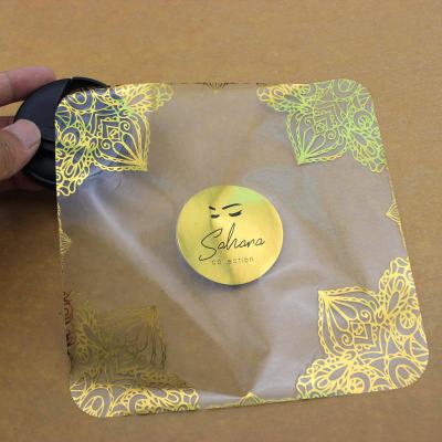 China Hot Stamping Logo Roll Waterproof Custom Adhesive Gold Foil Labels Waterproof Paper Stickers For Product Packing for sale