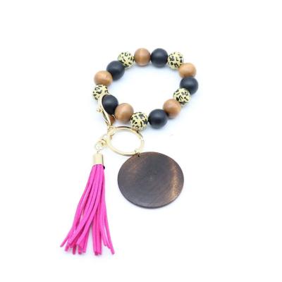 China Fanshion Customized Elastic Handmade Colorful Beaded Tassel Wooden Bracelet Keychains Wholesale Cheap for sale