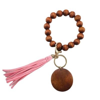 China Fanshion Customized Elastic Handmade Colorful Beaded Tassel Wooden Bracelet Keychains Wholesale Cheap for sale