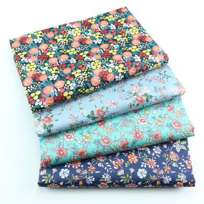 China Breathable Floral Blue Black Twill Cotton Sewing Fabric Making Sheet Quilt Cover Doll Clothes Dress Fabric for sale