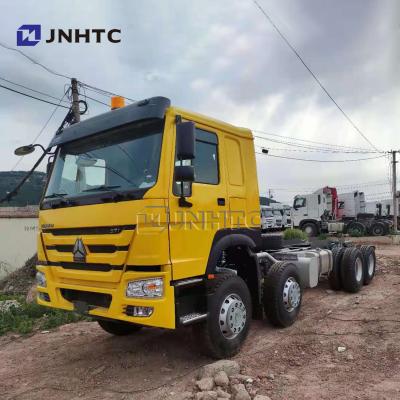 China Brand new transport goods sinotruk howo cargo truck chassis 8x4 12 wheeler model 9.6 meters box 30tons for sale