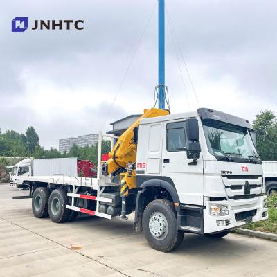 China TRUCK CRANE howo towing wrecker cargo 30Ton 6X4 flatbed cargo truck with telescopic booms mounted crane for sale for sale