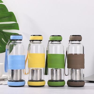 China Creative Sustainable Pumpkin Water Sports Glass Water Bottles Advertising Glass Water Bottle With Silicone Sleeve for sale