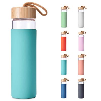 China 20 Ounce Borosilicate Glass Sustainable Eco Friendly Water Bottle With Bamboo Lid And BPA Free Silicone Sleeve for sale