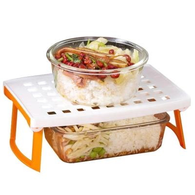 China Viable Plastic Universal Foldable Microwave Oven Steam Rack for sale