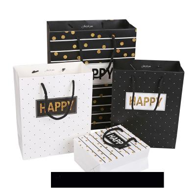 China Disposable Custom Design Paper Bag With Ribbon Handle Happy Gift Bag Wholesale Candy Packaging Craft Paper Bag for sale