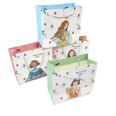 China Lady Paper Shopping Bag Disposable Fashion Children's Day Clothing Paper Craft Paper Bag Customized Paper Bag for sale