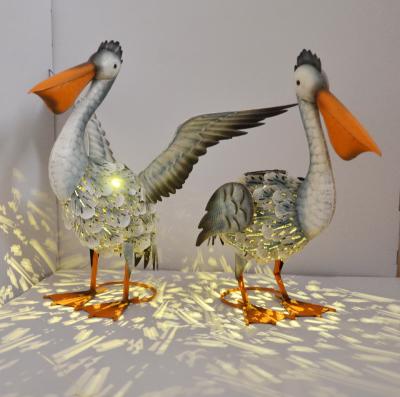 China Seabird Garden Statues Metal Pelican Figurine Statues With Light Seabird Garden Decoration for sale