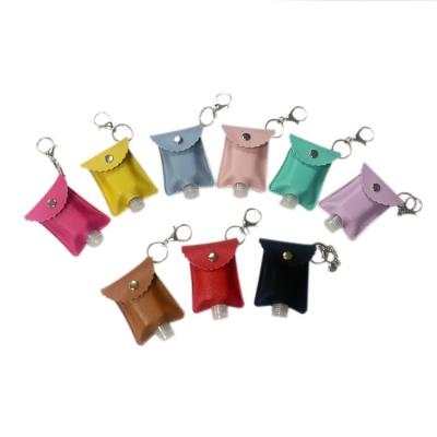 China Europe High Quality Christmas PU RTS Travel Bottle 30ml Portable Leather Hand Sanitizer Plastic Holder With Key Chain for sale