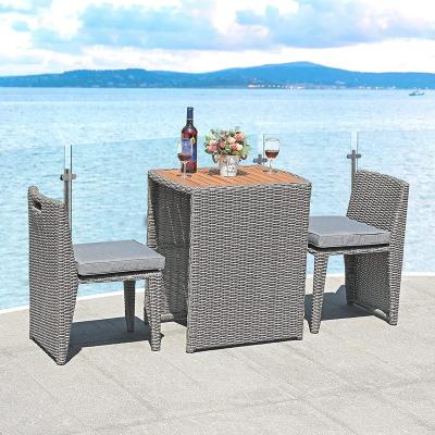 China Outdoor 3 Piece Rattan Dining Table Set Space Saving Patio Time Conversation Furniture Set Outdoor Wicker Bistro Set for sale