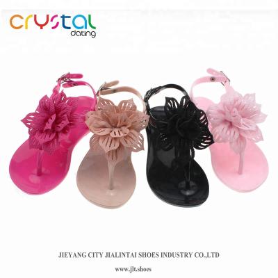 China PVC Ladie Kids T-Shape PVC Flat Sandals with Colorful Flower Accessories for sale