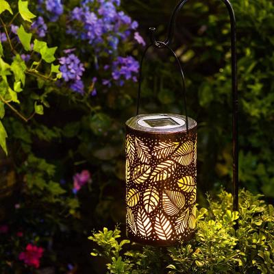 China Solar Charging Europe Style Vintage Lantern Lamp Outdoor Waterproof Hollow Carved Black Moroccan LED Flower Pattern Brown Table Light for sale