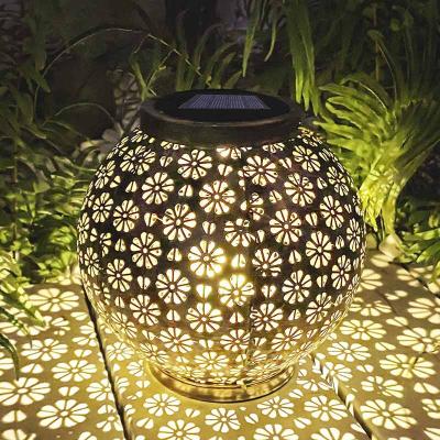 China Outdoor Decorative Led Charging Light Metal Pattern Lantern Solar Lamp Black Garden Lamp Original Design for sale