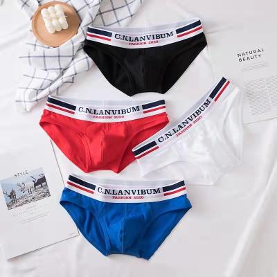 China Men's Solid Color U Low Waist Belt Underwear Austrian Cotton Breathable Traction Frame Briefs Men's Underwear for sale