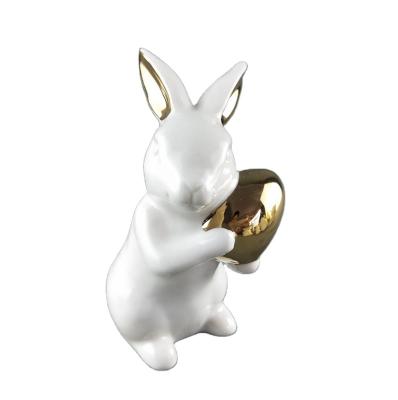 China Easter decoration / white ceramic cute bunnies home decor small with gold porcelain eggs decor for sale