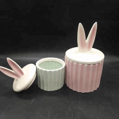 China Amazon viable hotsale Easter storage gift ceramic cylindrical candy jar boxes with Bunny Ear Lid for sale