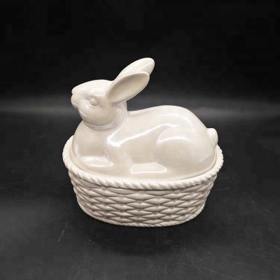 China Viable Unique Design Ceramic Storage Jar Rabbit Sitting On Basket For Easter Decoration for sale