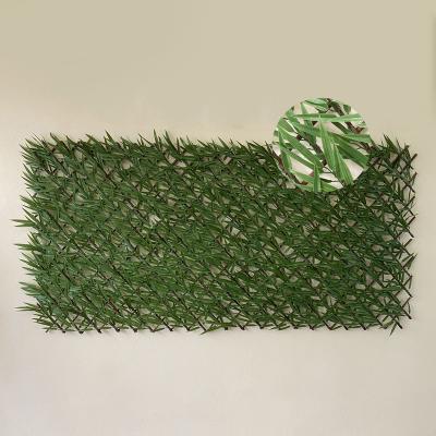 China Eco-friendly Artificial Retractable Plastic Willow Leaves Leaf Trellis Expanding Hedge Fence for sale