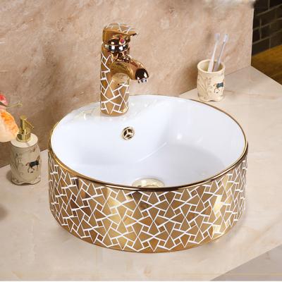 China Modern Design Round Wash Basin Counter Top Basin Hand Wash Luxury Gold Bathroom Gold Ceramic Sink for sale