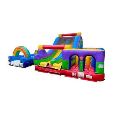 China Wholesale Inflatable House Games 0.55mm PVC Tarpaulin Rainbow Color Bounce Obstacle Course With Slide for sale