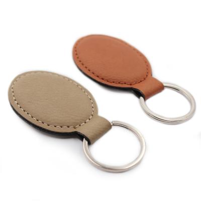 China PU Dangling Logo Litchi Leather Key Chain Custom Promotion Personality Top Oval Handmade Purse Bag for sale