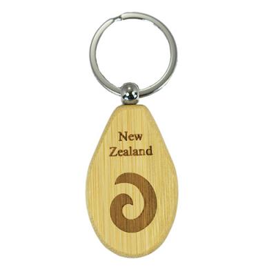 China Plug Coin Fashion Gift Carved New Zealand Wooden Souvenir Key Chain Wooden Name Keychains for sale