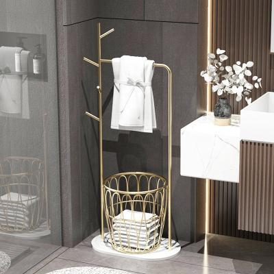 China 2022 modern new light luxury simple modern bathroom shelf floor marble iron gold towel rack toilet shelf rack for sale