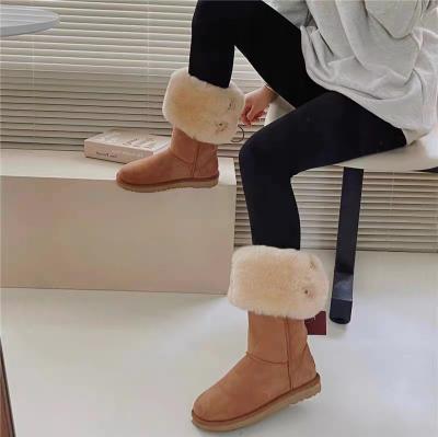 China Cushioning 2023 Star Button Two Snow Boots Winter Female Sheepskin Wool Knocked Down Warm Woolen Winter Female Boots High Boots for sale