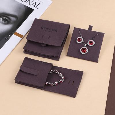 China Recyclable Customize Logo Luxurious Soft Microfiber Jewelry Pouch Bag For Women Earrings Jewelry Packaging for sale