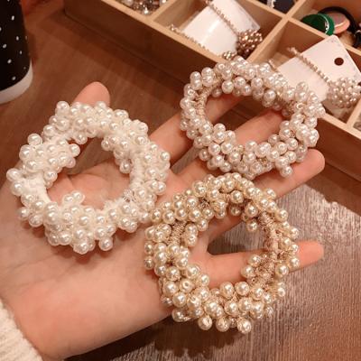 China Sweet Classic Women Hair Accessories Bracelet Beads Hair Scrunchies Elastic Hair Ties And Bracelets Link for sale