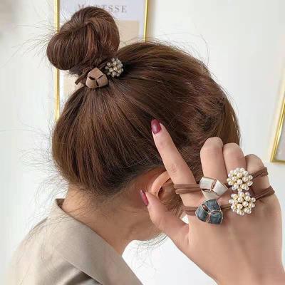 China Latest Sweet Headband Designs Korean Simple Pearl Flower Braided Elastic Hair Bands for sale