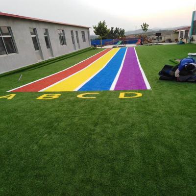 China PP+PE 50MM PE 12000d Soft Artificial Lawn Mat Synthetic Grass In Football Ground Sports Flooring for sale