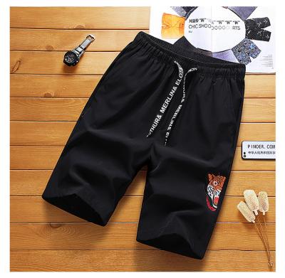 China QUICK DRY Elastic Shorts Men's Summer Casual Pants Trend Embroidered Loose Sweatpants Men's Middle Beach Pants for sale