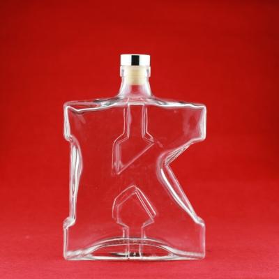 China High Quality 70cl K Glass Wine Shaped Glass Bottle 75cl Glass Rum Carve Surface Handling Bottle for sale