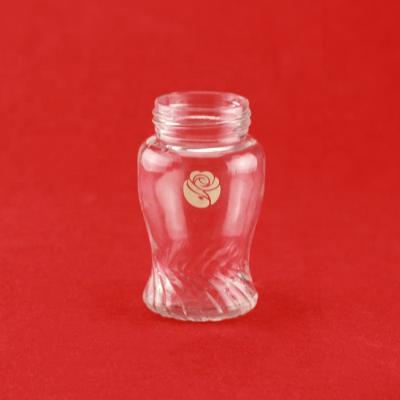 China Unique Food Grade Shape Printing Gold Flower Glass Jar With Screw Top Lid for sale