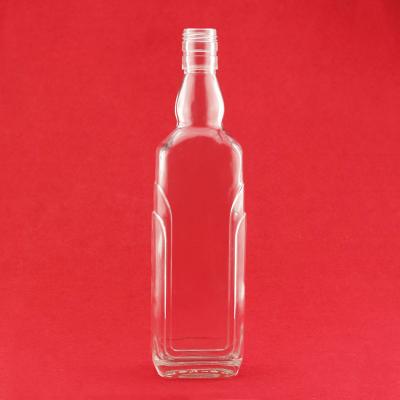 China Factory Made Brandy Glass Bottle Flat Shape 500ml 700ml High Flint Embossed Logo Brandy Bottle With Foil Cap for sale