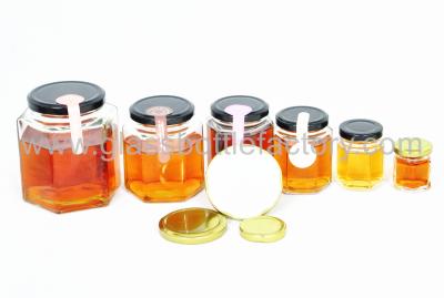 China Clear Glass Hexagonal Jars With Lids for sale